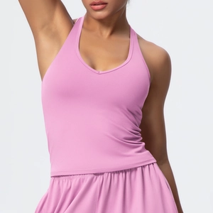 Macro shot of pink V-neck sports bra fabric showing high-elasticity texture and stitching