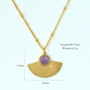 Detailed view of fan-shaped pendant necklace with purple stone and 40+5cm gold chain