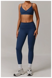 Detail view of dark blue recycled v-neck sports bra and high waist yoga leggings set