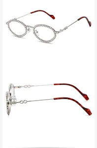 Detail of oval silver rhinestone sunglasses with side views and tortoiseshell tips