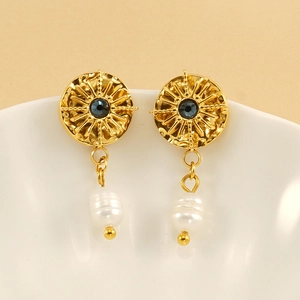 Vintage starburst earrings with dark blue gemstone and baroque pearl drop in gold finish