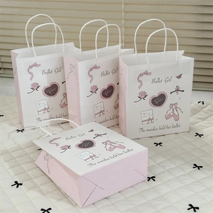 Detail of pink and white Ballet Girl gift bags with ribbon and floral illustrations