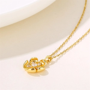 Elegant 18K gold-plated flower pendant necklace with shimmering zircon on a white background