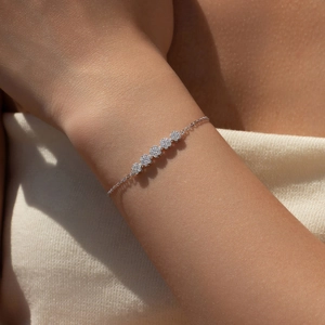 Elegant S925 sterling silver flower bracelet with sparkling crystals on a woman's wrist