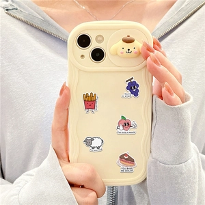 Detail of creamy yellow silicone phone case with Sanrio Pompompurin and food stickers