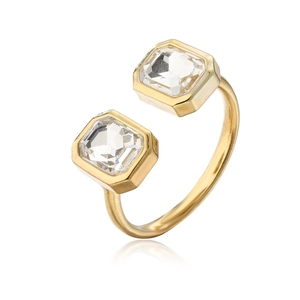 Detail of 18K gold-plated bypass ring with emerald-cut cubic zirconia and open band
