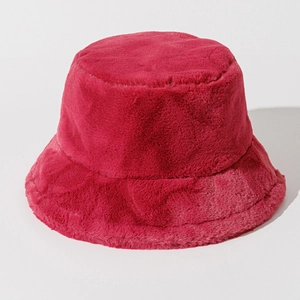 Detail shot of fluffy red faux fur texture on a warm winter bucket hat for women