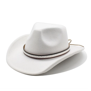 Detail of white felt cowboy hat featuring metallic stars on a leather decorative band