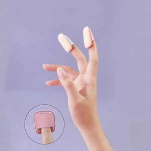 Mini pink finger puff for makeup detail with elastic strap and zoomed-in texture view