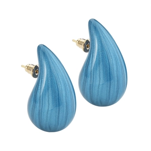 Blue chunky teardrop stud earrings with silk texture finish on a clean white background