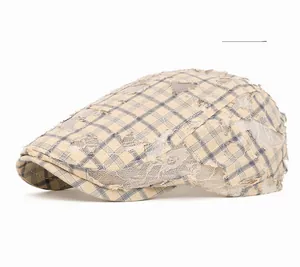Detail of blue plaid flat cap with distressed lace mesh and vintage textured fabric