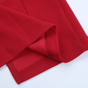 Close-up of red dress featuring premium knit texture and durable double-stitch seams