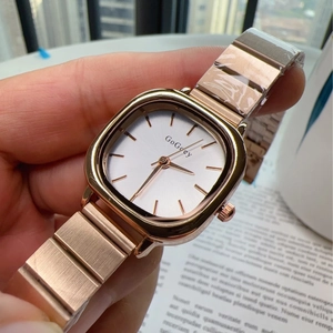 Minimalist women's rose gold square quartz watch with a white dial and metal strap