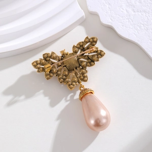 French vintage gold brooch with colorful crystals and a teardrop pearl pendant back view