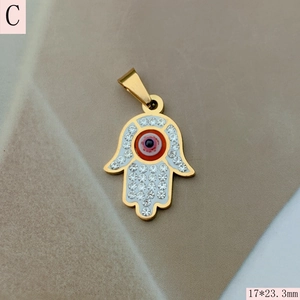 Macro shot of 17x23.3mm Hamsa hand pendant with evil eye and crystal rhinestones