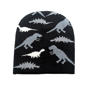 Detailed view of the fine knit texture and cartoon dinosaur patterns on the beanie