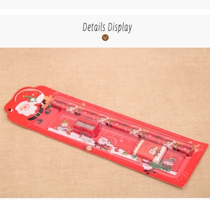 Close-up of red Christmas stationery set including pencils, ruler, and eraser