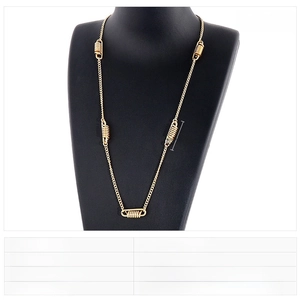 Detail view of gold stainless steel spring necklace showing 600mm length and 3mm width