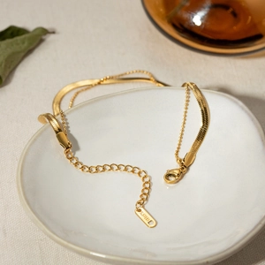 18K gold plated stainless steel double layer snake and bead chain anklet on ceramic