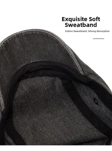 Detail of soft cotton sweatband inside a washed dark gray canvas newsboy flat cap