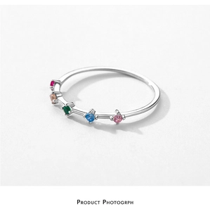 Macro shot of S925 sterling silver ring featuring five colorful round-cut zircon stones