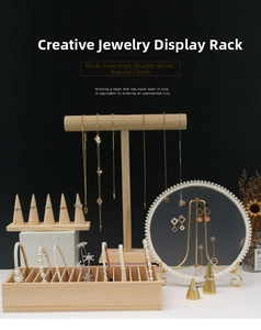Detail of wooden jewelry display set featuring T-bar stand and conical ring holders