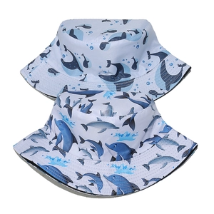 Light blue sun bucket hats with dolphin and whale prints for beach vacation use