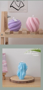 Detailed view of pastel geometric scented candles on wooden stands for home decor