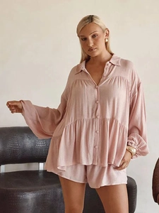 Detail of mauve lantern sleeve button shirt and matching textured shorts vacation set