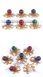 Colorful resin octopus figurines with crushed crystal stones and gold glitter details