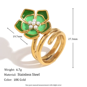 Detail view of 18K gold ring with green enamel flower, pearl center and measurement data