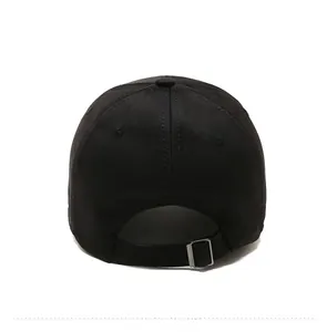 Detail view of the back of a black cotton baseball cap with adjustable metal buckle
