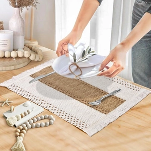 Bohemian jute and cotton placemat with fringe, set with white ceramic plate