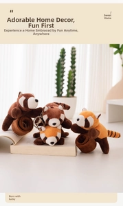 Cute panda plush keychain and curtain tie with soft fur detail in warm home setting