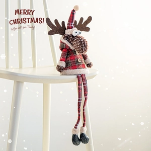 Christmas plush reindeer doll with red plaid legs sitting on a white chair decoration