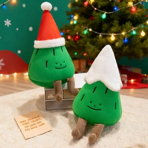 Cute plush Christmas tree dolls with hats and long legs in a warm festive setting
