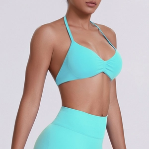 Detail of seamless ribbed mint green halter sports bra and high waist leggings set
