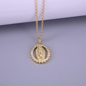 Close-up of Virgin Mary oval pendant with gold relief and white zircon crystals