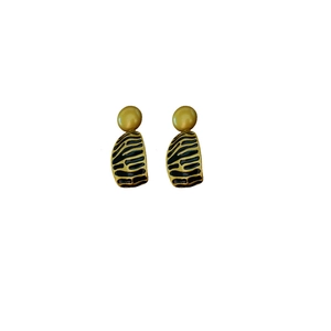 Vintage irregular round earrings with gold and black enamel zebra pattern on white background
