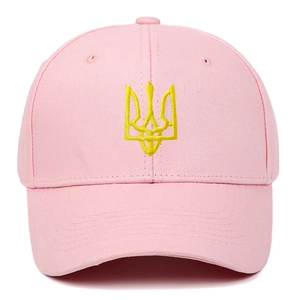 Close-up of yellow trident embroidery on a pink cotton washed baseball cap