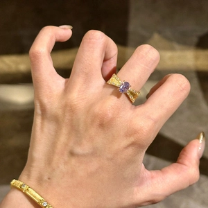 French vintage gold bow ring and bracelet set with purple stones and diamonds