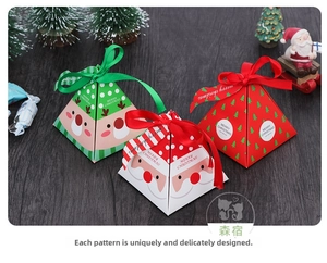 Detailed view of pyramid Christmas gift boxes with festive ribbons on a wooden background