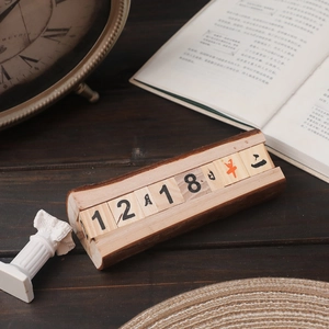 Vintage wooden perpetual calendar decor with natural bark edge and sliding date blocks