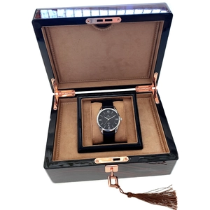 Polished dark wood watch box with rose gold hardware and beige velvet lining for men