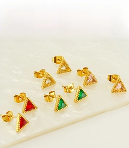 Macro shot of 18K gold plated triangle stud earrings with colorful zircon stones set in gold