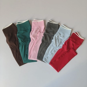 Detail view of high waist yoga leggings showing six colors and peach butt lift design