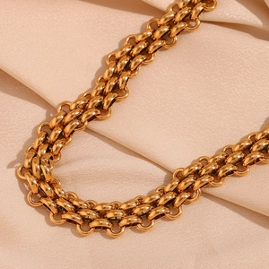 Close-up of triple-layered 18K gold plated stainless steel chunky chain on champagne silk