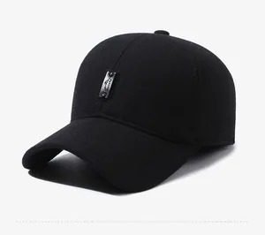 Detail view of winter baseball cap with ear flaps and embossed sports leather patch