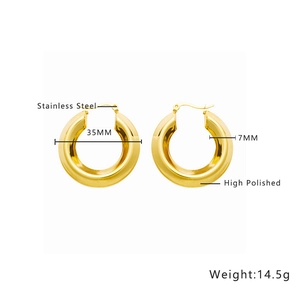 Macro detail of 35mm high polished gold stainless steel chunky hoop earrings