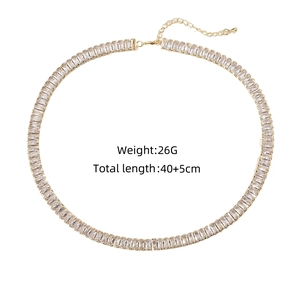 Detail view of gold tennis necklace with rectangular zircons and length specifications